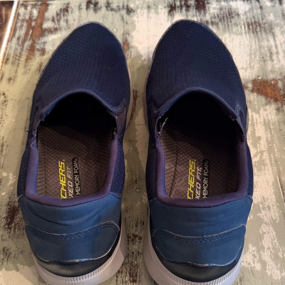 Men’s blue Skechers loafers, size 10.